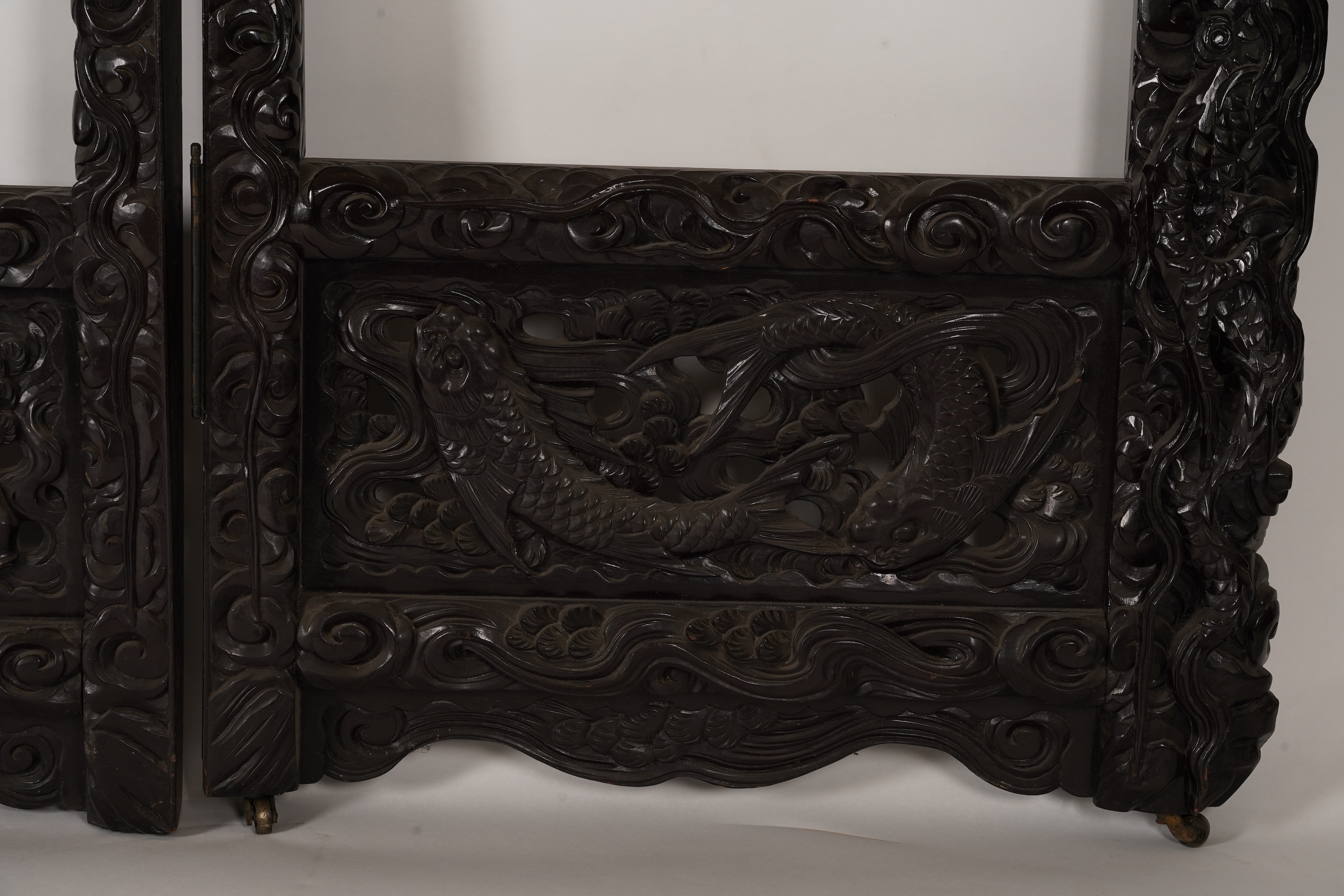 A pair of large Japanese carved hardwood ’dragon’ screen frames, Meiji period